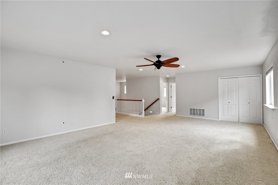 17264 Southeast 185th Street Renton, WA 98058 - Photo 21 of 40 an empty room with a ceiling fan and window