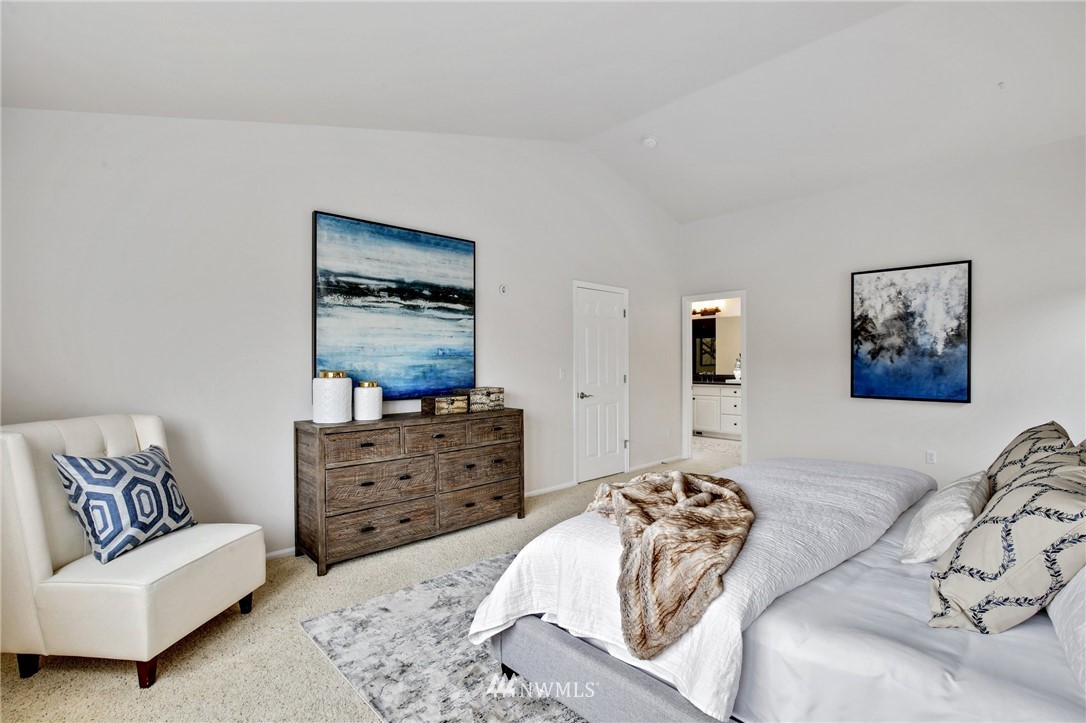 17264 Southeast 185th Street Renton, WA 98058 - Photo 26 of 40 a bedroom with a bed and a couch