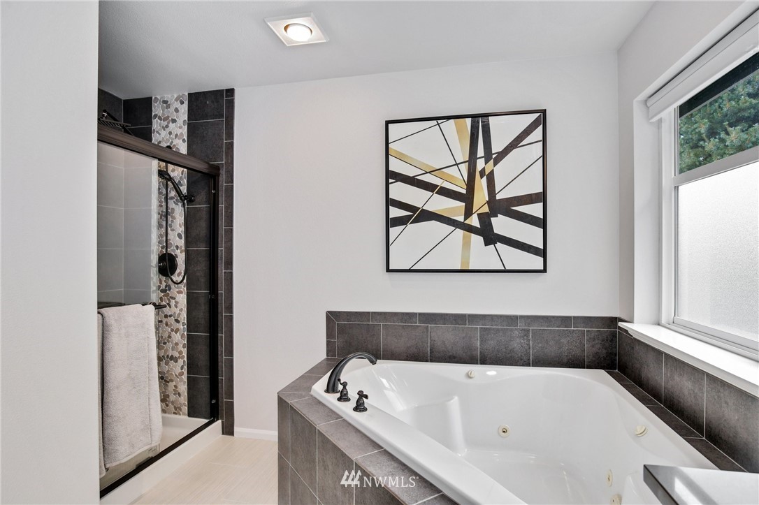 17264 Southeast 185th Street Renton, WA 98058 - Photo 30 of 40 a bathroom with a bathtub and a window