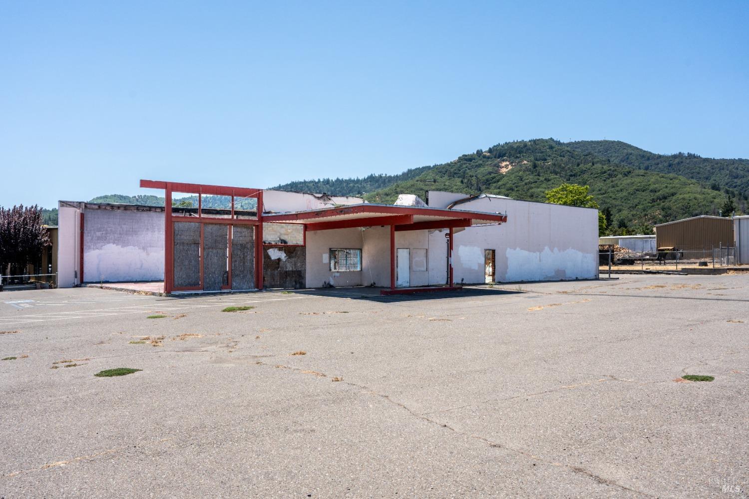 1320 South State Street Ukiah, CA 95482 - Photo 2 of 4 a front view of a house with a yard and parking space