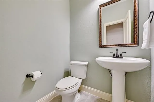 a bathroom with a sink and a toilet
