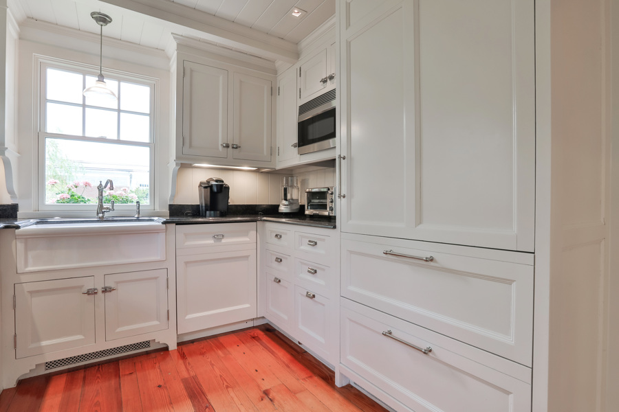 37 West Tisbury Road Edgartown, MA 02539 - Photo 11 of 45 a kitchen with white cabinets and window