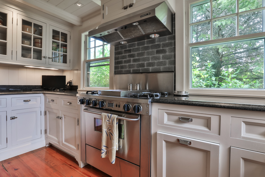 37 West Tisbury Road Edgartown, MA 02539 - Photo 12 of 45 a kitchen with granite countertop a stove and a sink