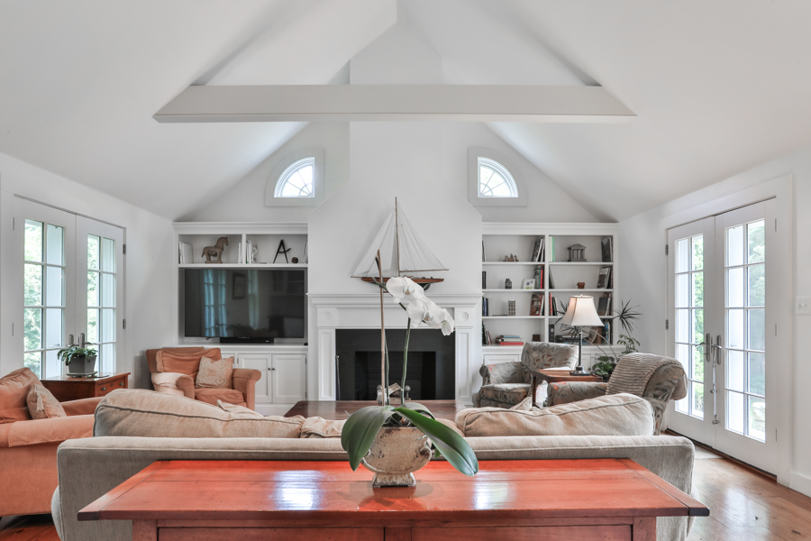 37 West Tisbury Road Edgartown, MA 02539 - Photo 16 of 45 a living room with furniture fireplace and a large window