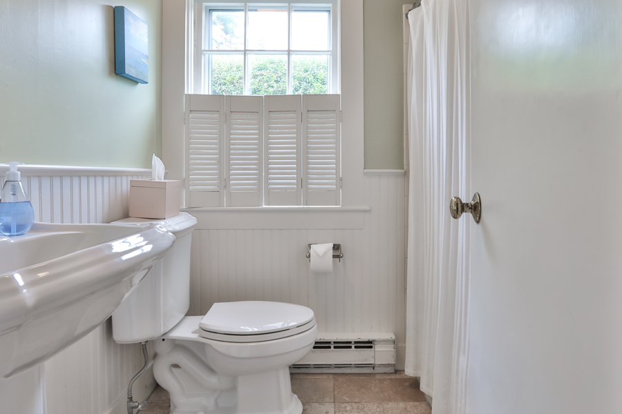 37 West Tisbury Road Edgartown, MA 02539 - Photo 24 of 45 a bathroom with a toilet a sink and a window