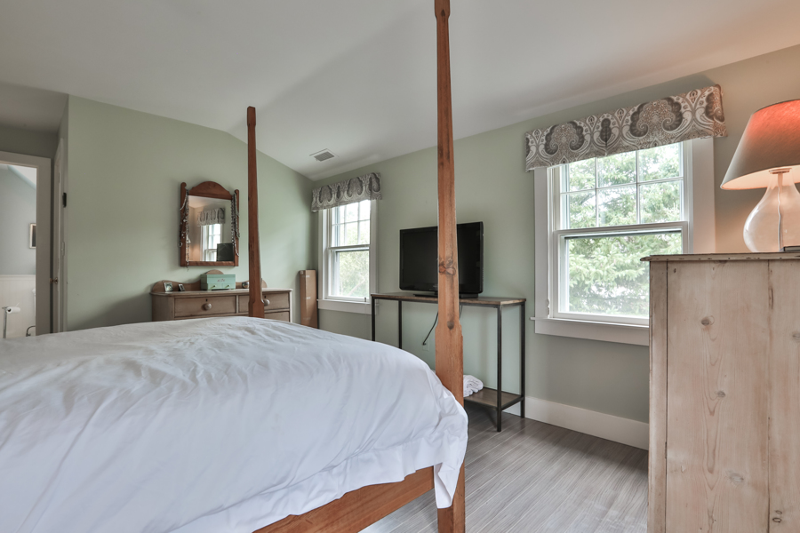 37 West Tisbury Road Edgartown, MA 02539 - Photo 31 of 45 a bed sitting in a spacious bedroom next to a window