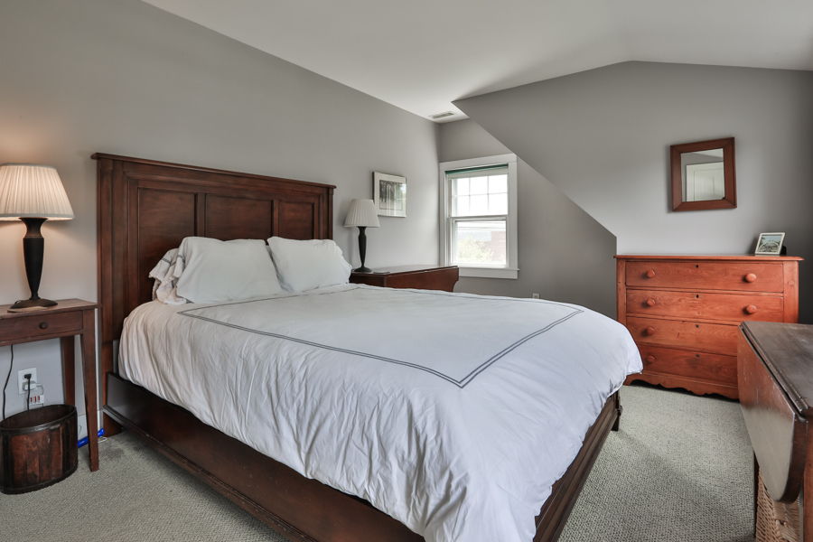 37 West Tisbury Road Edgartown, MA 02539 - Photo 37 of 45 a bedroom with a bed and window