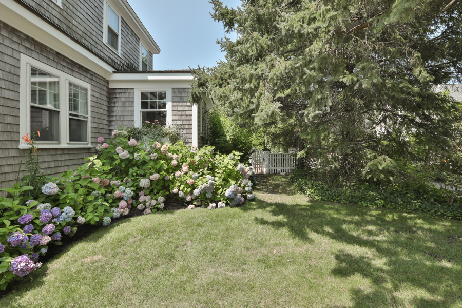 37 West Tisbury Road Edgartown, MA 02539 - Photo 6 of 45 a view of a house with a flower garden