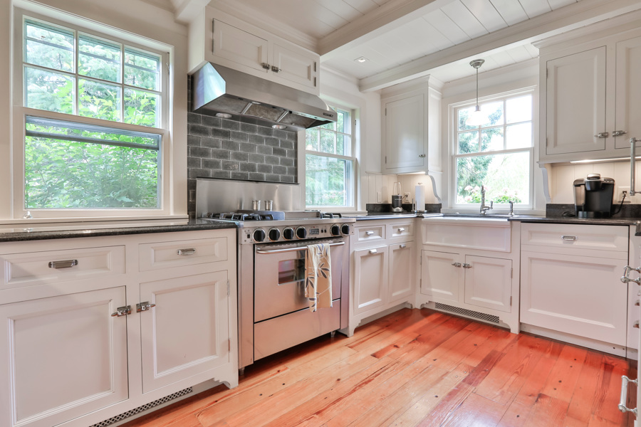 37 West Tisbury Road Edgartown, MA 02539 - Photo 9 of 45 a kitchen with granite countertop white cabinets and white appliances
