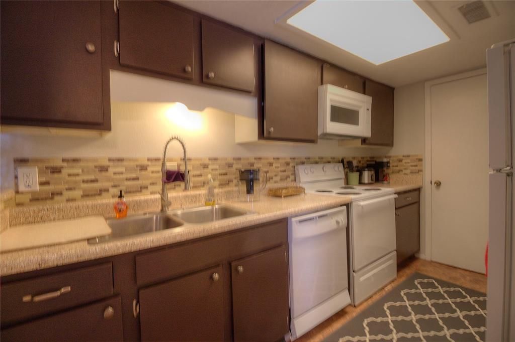 12818 Midway Road, Unit 2068 Dallas, TX 75244 - Photo 8 of 12 a kitchen with sink and cabinets