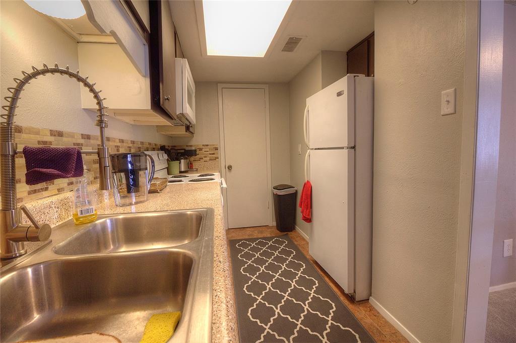 12818 Midway Road, Unit 2068 Dallas, TX 75244 - Photo 10 of 12 a bathroom with a tub and shower