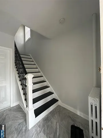 a view of a hallway with staircase