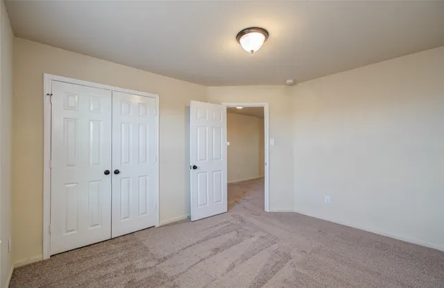 a view of a house with backyard and porch
