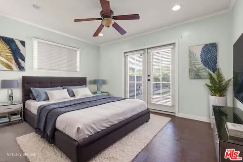 a spacious bedroom with a large bed and a window