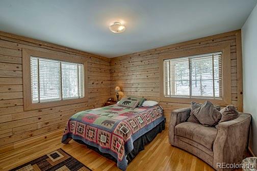 146 Protector Place Breckenridge, CO 80424 - Photo 14 of 18 a bedroom with a bed couch and windows