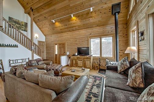 146 Protector Place Breckenridge, CO 80424 - Photo 3 of 18 a living room with furniture or couch and a flat screen tv
