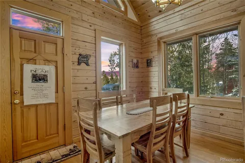 a dining room with furniture window and outside view