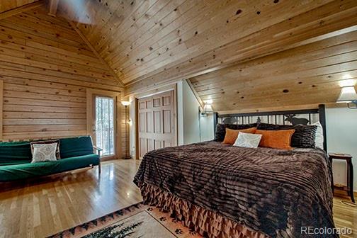 146 Protector Place Breckenridge, CO 80424 - Photo 9 of 18 a large bed sitting in a bedroom next to a window