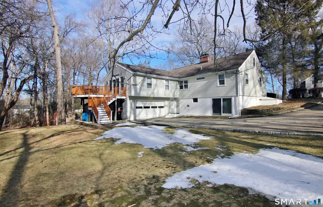 a view of a room with wooden floor and windows