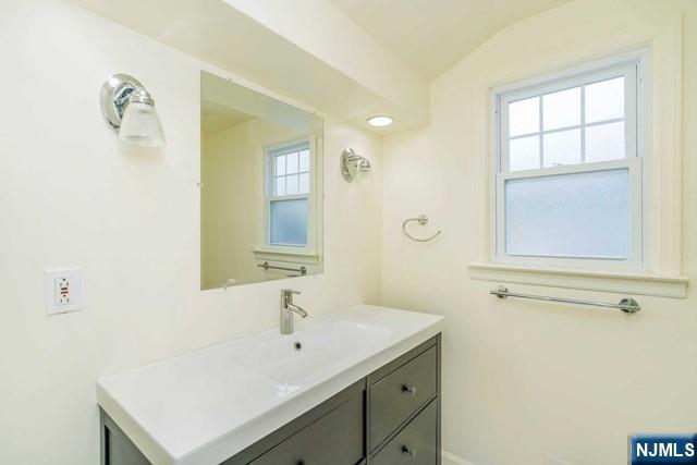 10 Gwynne Court Closter, NJ 07624 - Photo 14 of 22 a bathroom with a sink and a mirror