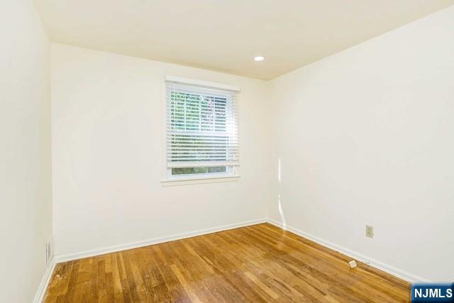 10 Gwynne Court Closter, NJ 07624 - Photo 16 of 22 a view of empty room with wooden floor