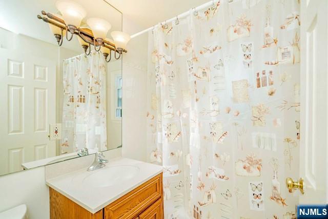 10 Gwynne Court Closter, NJ 07624 - Photo 18 of 22 a bathroom with a sink toilet double vanity and shower