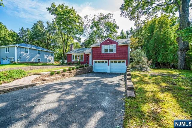 10 Gwynne Court Closter, NJ 07624 - Photo 2 of 22 a front view of a house with a yard