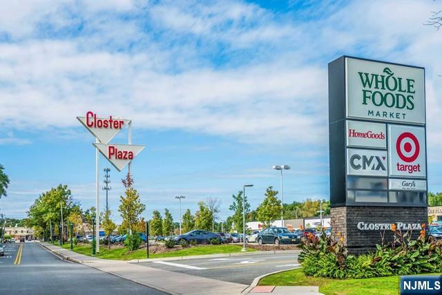 10 Gwynne Court Closter, NJ 07624 - Photo 22 of 22 a street sign on a wall next to a road