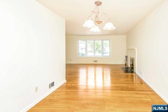 10 Gwynne Court Closter, NJ 07624 - Photo 5 of 22 a view of a room with wooden floor and natural light