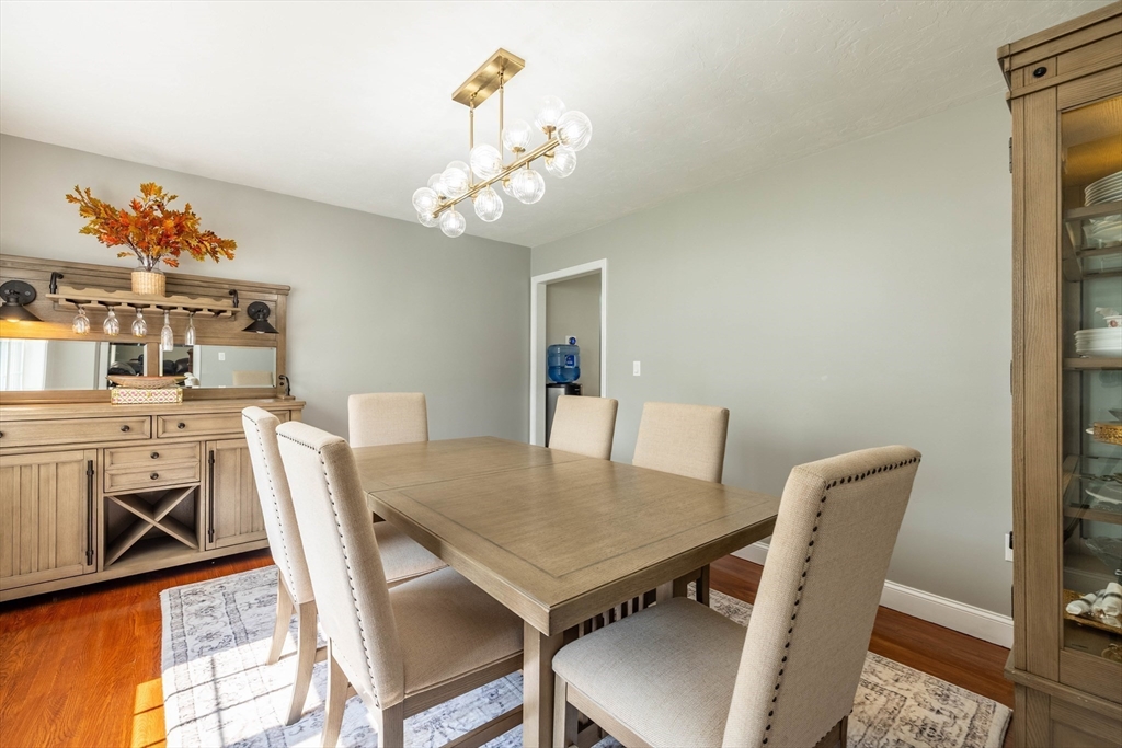 63 Lippold Street Methuen, MA 01844 - Photo 11 of 42 a view of a dining room with furniture and wooden floor
