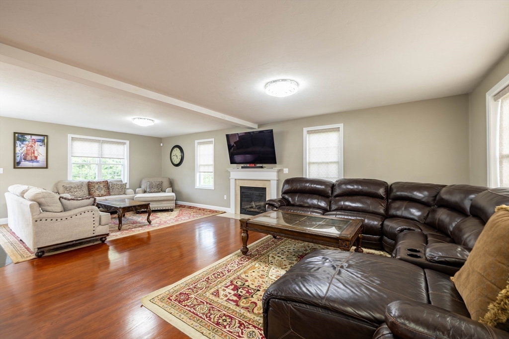 63 Lippold Street Methuen, MA 01844 - Photo 13 of 42 a living room with furniture and a flat screen tv