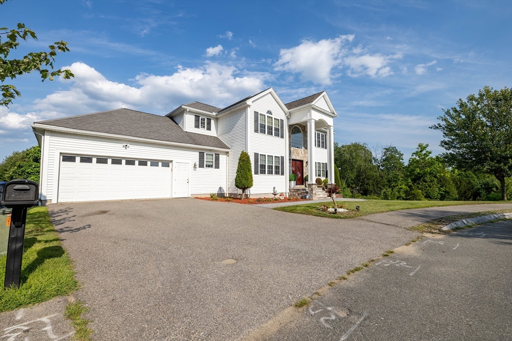 63 Lippold Street Methuen, MA 01844 - Photo 2 of 42 a view of a street with a building in the background