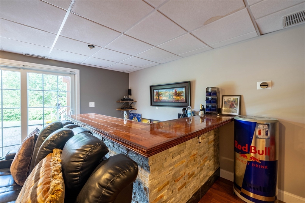 63 Lippold Street Methuen, MA 01844 - Photo 29 of 42 a bed room with furniture and a flat screen tv