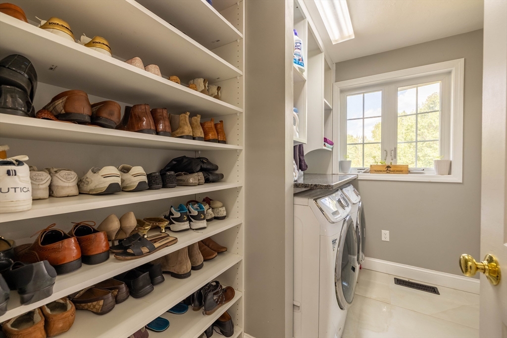 63 Lippold Street Methuen, MA 01844 - Photo 31 of 42 a room with lots of different colored cloths