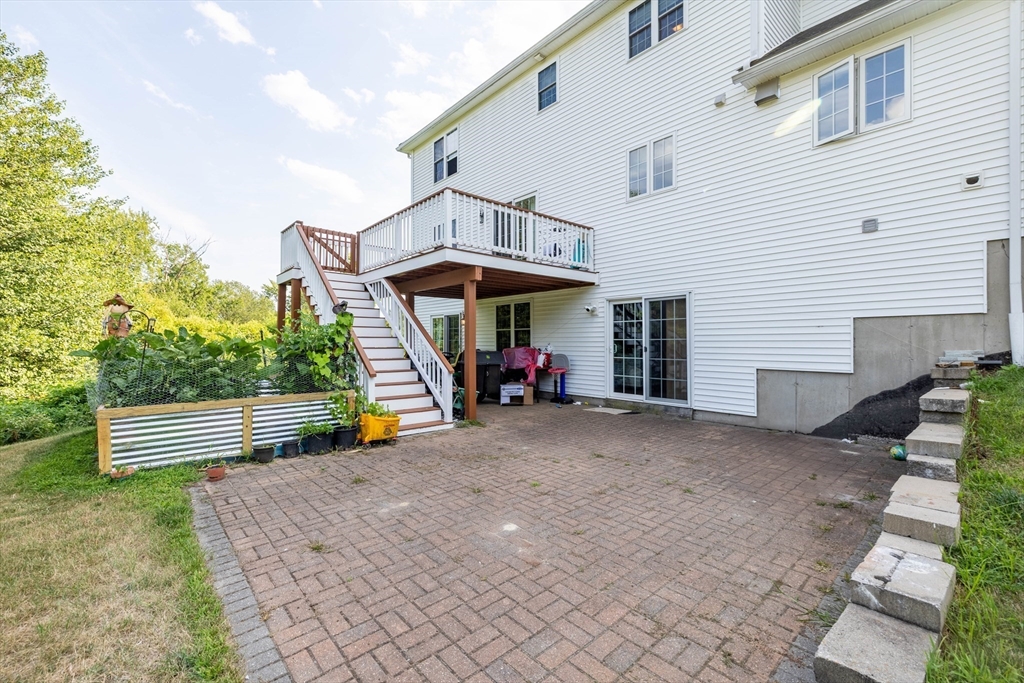 63 Lippold Street Methuen, MA 01844 - Photo 33 of 42 a view of a house with a patio