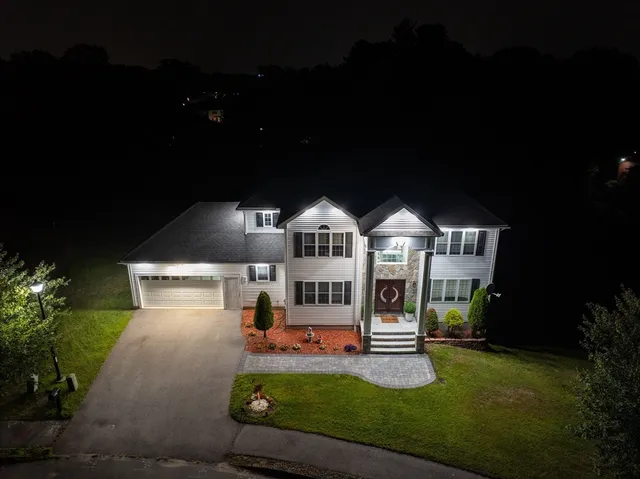 a front view of a house with a yard