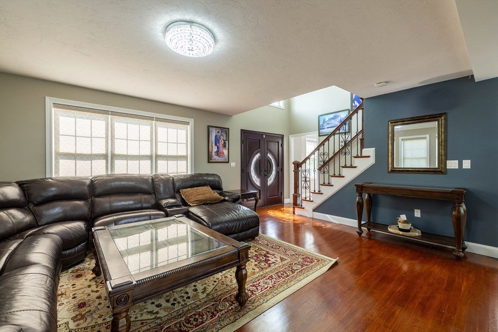 63 Lippold Street Methuen, MA 01844 - Photo 6 of 42 a living room with furniture and a fireplace