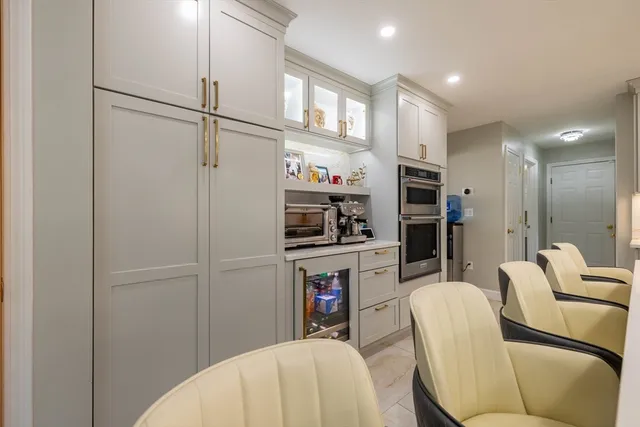 a kitchen with stainless steel appliances a refrigerator and a refrigerator