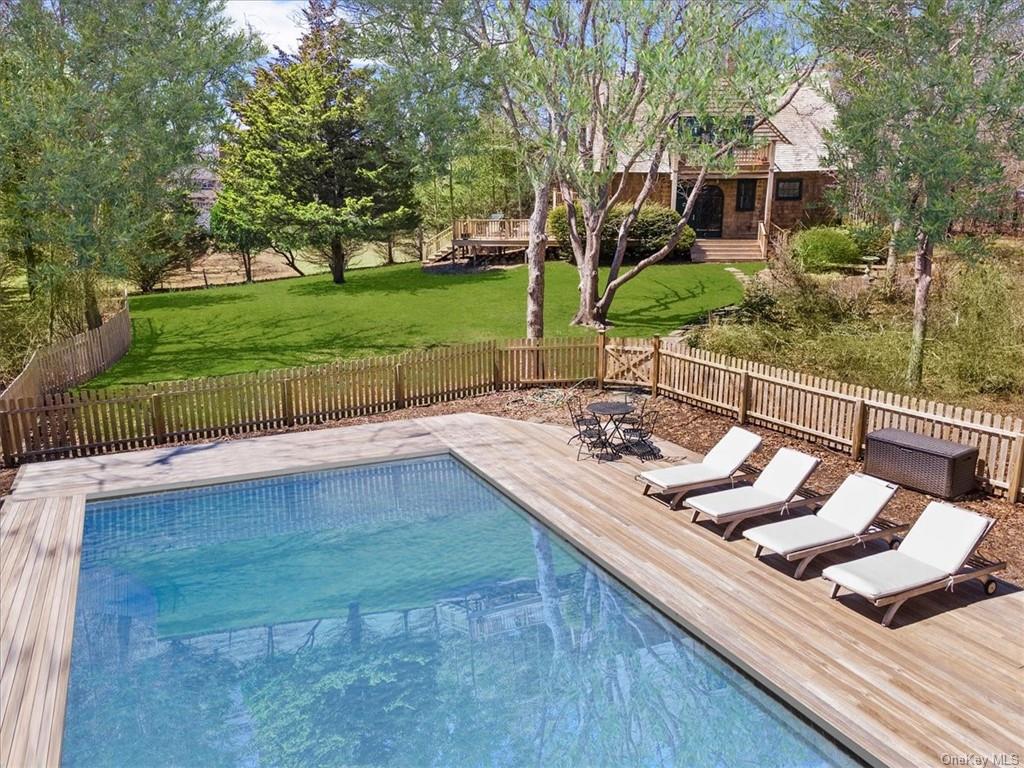 350 Montauk Highway Southampton, NY 11968 - Photo 1 of 34 a view of a backyard with sitting area