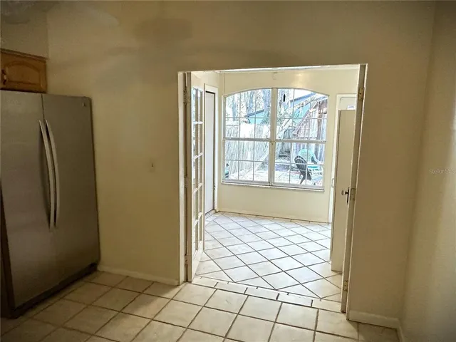 a view of an empty room with windows