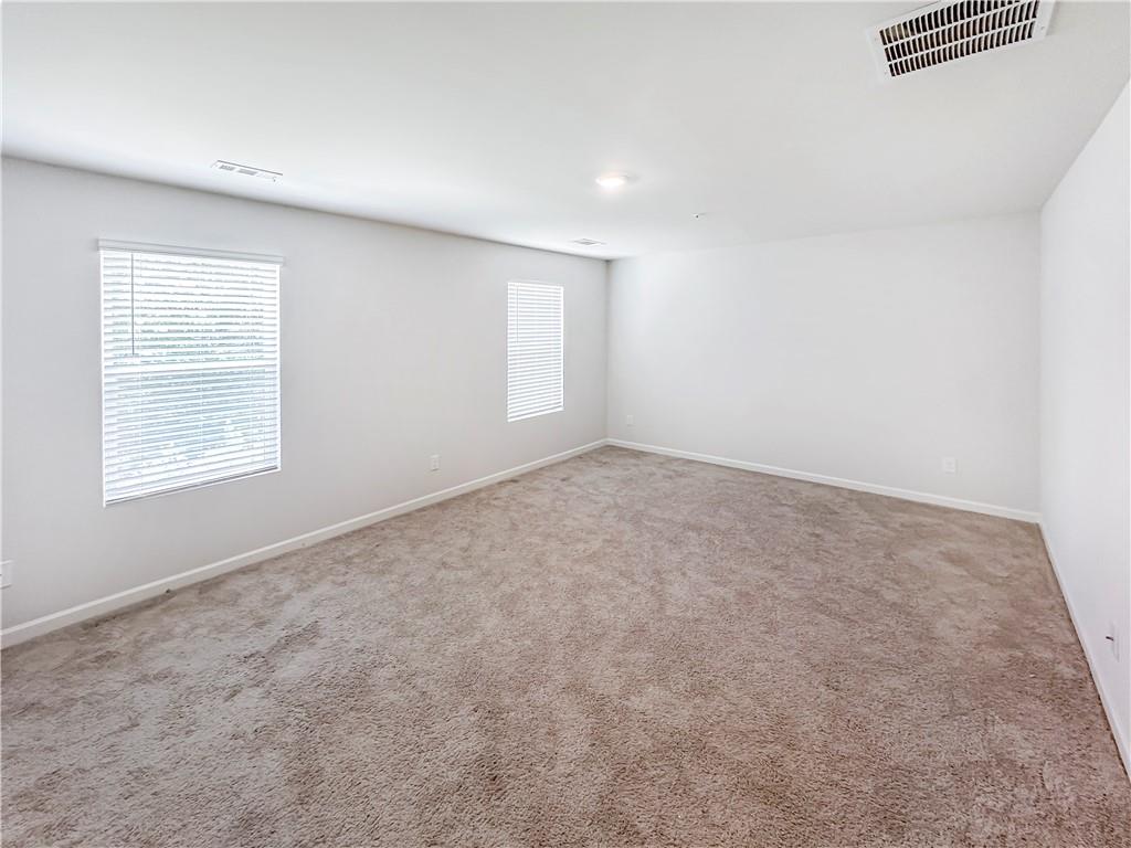 965 Athena Bend Fairburn, GA 30213 - Photo 17 of 37 an empty room with windows