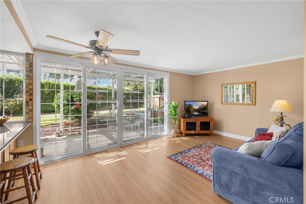 1934 Westmoreland Drive Brea, CA 92821 - Photo 13 of 50 a living room with furniture a flat screen tv and a floor to ceiling window