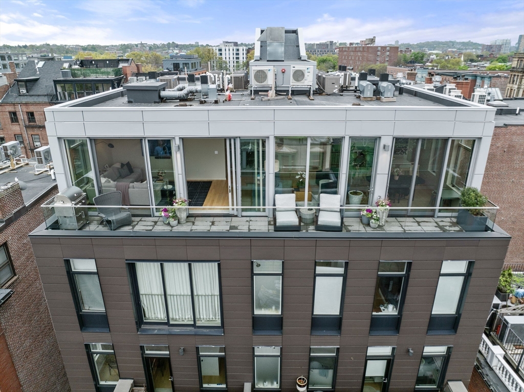 7 East Springfield Street, Unit PH6 Boston, MA 02118 - Photo 2 of 42 a front view of a residential apartment building with a yard