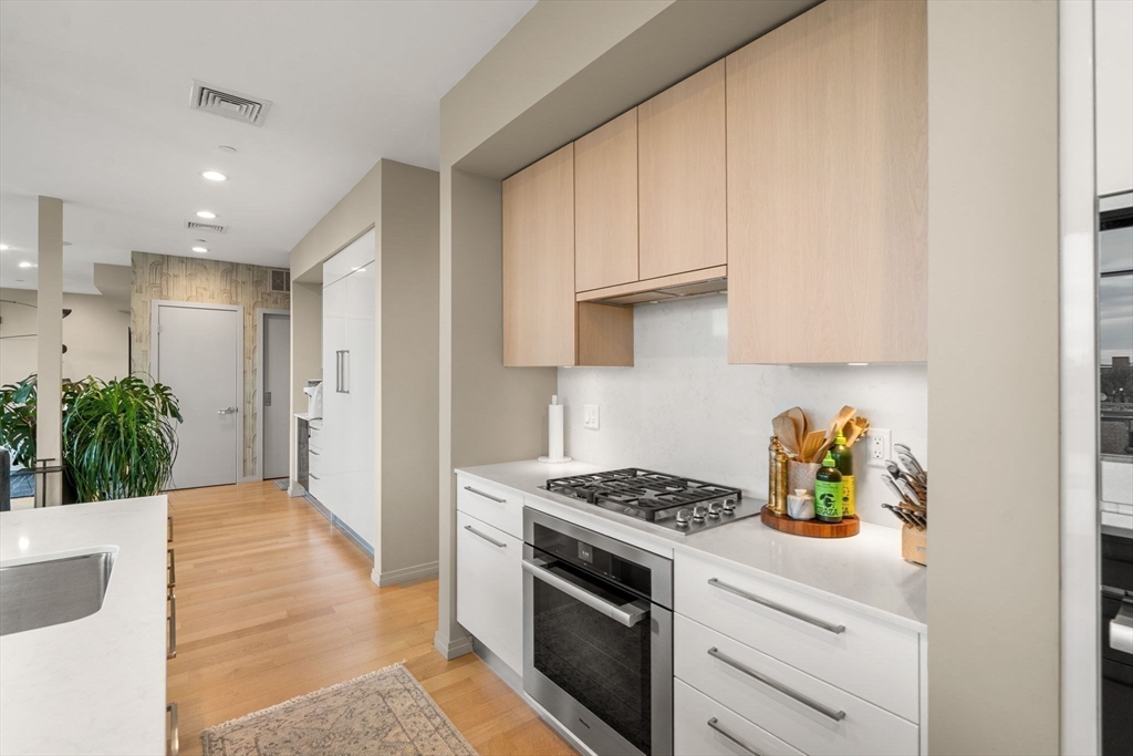 7 East Springfield Street, Unit PH6 Boston, MA 02118 - Photo 21 of 42 a kitchen with white cabinets and appliances