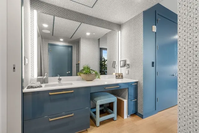 a bathroom with a sink and a mirror