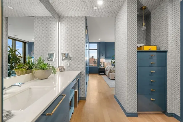 a bathroom with a shower and a sink