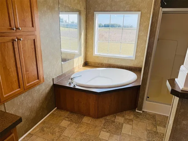 a bathroom with a tub and sink