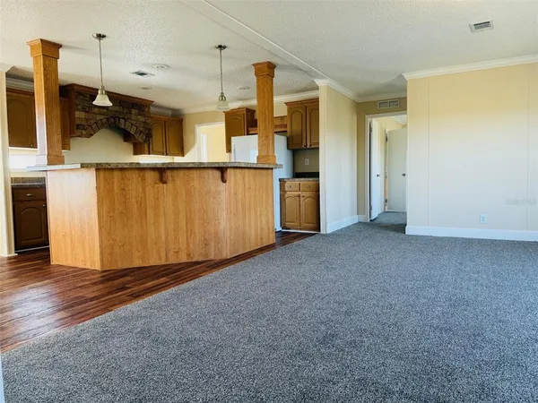 a view of a kitchen with a sink