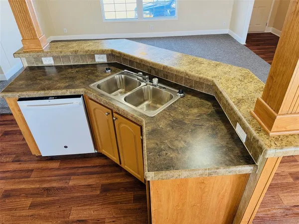 a utility room with a sink washer and dryer