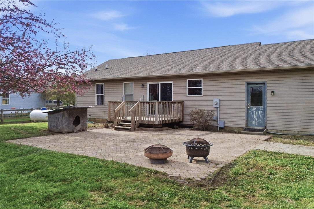 8747 Waynes Way Blanchester, OH 45107 - Photo 35 of 40 This outdoor space offers a charming deck and expansive patio perfect for gatherings.